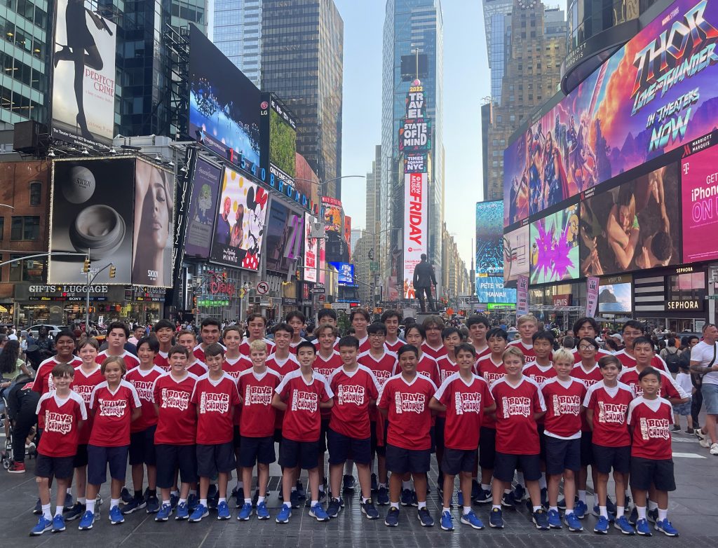 Picture of 50 pre teen boys from the All American Boys Chorus in Times Square, New York