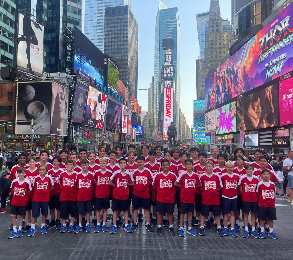 Picture of 50 pre teen boys from the All American Boys Chorus in Times Square, New York